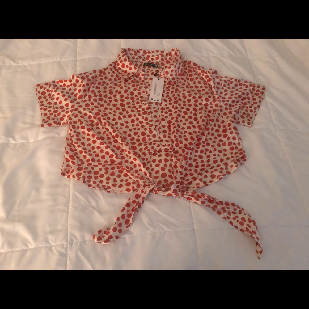 Cream and burnt orange crop top.